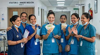 Hospital Nurse Holdig Money